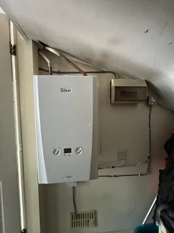 Gas Safe boiler installation with pipework and hot-water cylinder | view 2