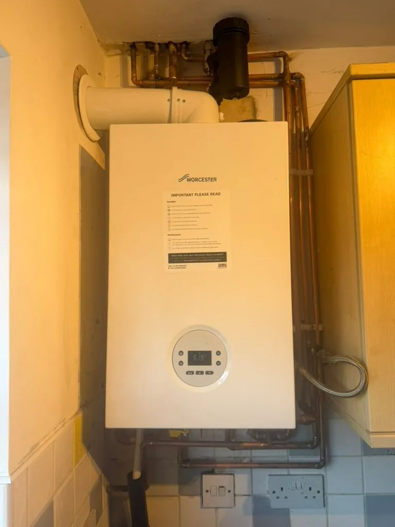 Gas Safe boiler installation with pipework and hot-water cylinder by Warm-Wise