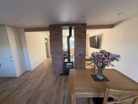 Full house renovation in Crewe with open-plan kitchen and multi-fuel stove by Warm-Wise